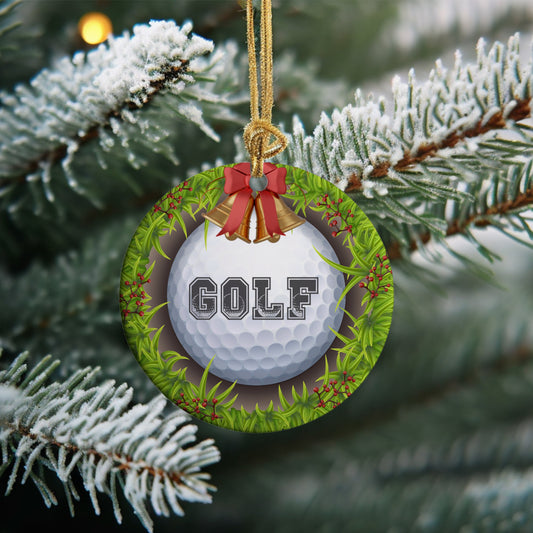 Golf Christmas ornament showcases a golf ball in the hole with the word Golf on it decorated with Christmas bells and berries. 